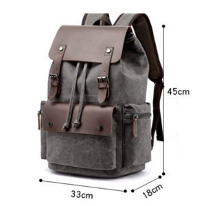 a grey men 's backpack with a brown leather strap